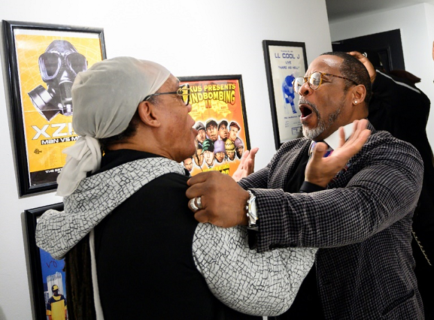 Melvin Glover, aka Melle Mel (L), greets Guy O'Brien, aka Master Gee, from the Sugarhill gang before a joint concert at the hip-hop pop-up museum at the Hip-Hop Museum. PHOTO: AFP