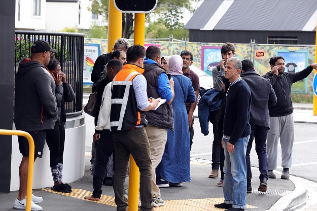 Residents gathering close to the mosque after a firing incident in Christchurch. PHOTO: AFP