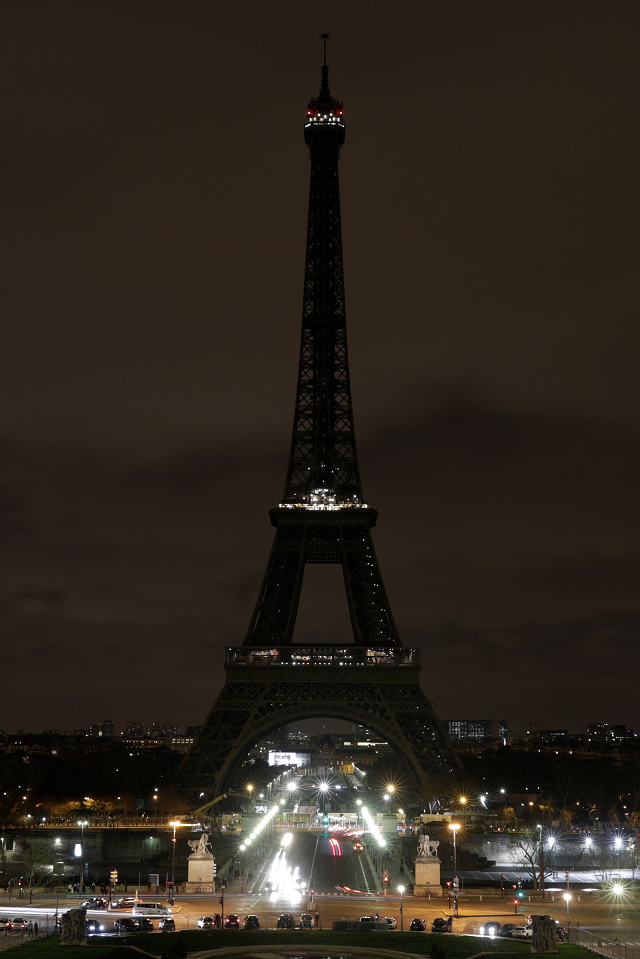 The lights of the Eiffel Tower go off in tribute to the victims of the Christchurch, New Zealand, terror attack in Paris. PHOTO: AFP