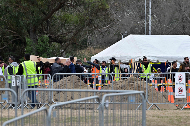 Mourners proceed with the carry at the Memorial Park Cemetery in Christchurch. PHOTO: AFP