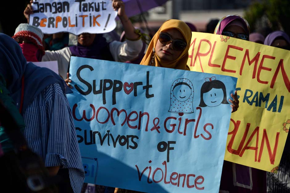 Activists takes part in an event to mark International Women's Day in Banda Aceh, Aceh province. PHOTO: AFP