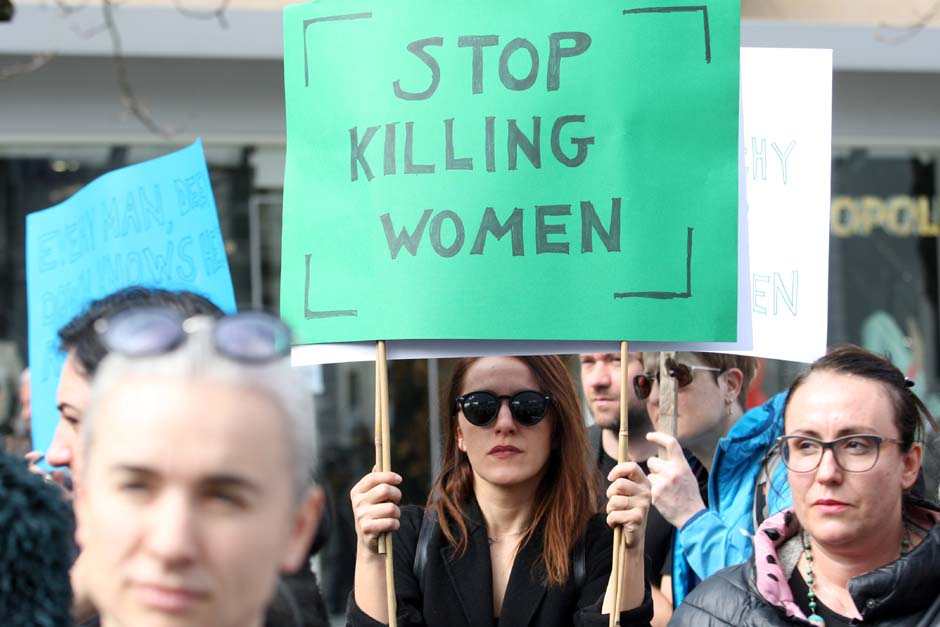 Women's rights activists wearing black as a sign of mourning for the victims of violence hold posters condemning violence against women during a rally in downtown Tirana, Albania March 8, 2019. The banner reads: 