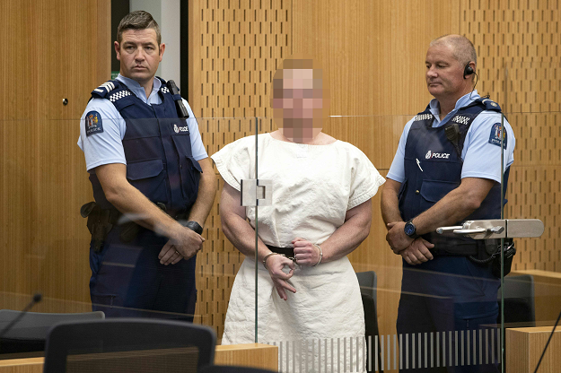 Brenton Tarrant, the accused Christchurch shooter, makes a white power sign during his court appearance. PHOTO: AFP