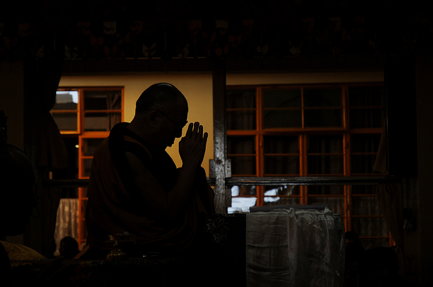 In this file photo taken on October 19, 2011 the Dalai Lama prays during a day-long fast and prayer service in honour of Tibetans who set themselves on fire to protest the Chinese rule in Tibet, at Tsuglagkhang Temple in McLeod Ganj. PHOTO: AFP