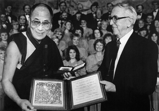 In this file photo taken on December 10, 1989 Tibetan spiritual leader the Dalai Lama (L) receives the 1989 Nobel Peace Prize from Egil Aarvik, chairman of the Norwegian Nobel Committee on December 10, 1989 at Oslo University. PHOTO: AFP