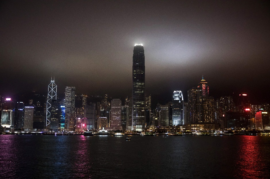 The Victoria Harbour is seen before being plunged into darkness for the Earth Hour environmental campaign in Hong Kong on March 30, 2019. PHOTO: AFP