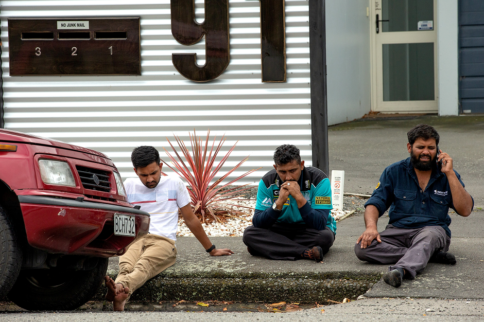 Grieving members of the public following a shooting at the Al Noor mosque in Christchurch, New Zealand. PHOTO: REUTERS