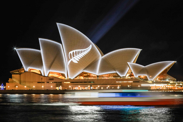 This hand out picture taken by Salty Dingo and released by the New South Wales (NSW) Government on March 17, 2019 shows the sails of the Sydney Opera House seen lit with the design of New Zealand's silver fern organised by the NSW government in a show of solidarity with victims of the Christchurch mosque attacks, in Sydney. PHOTO: AFP