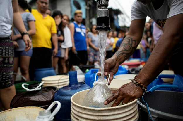 The shortages started hitting late last week, with some areas in eastern Manila seeing the supplies of water into their homes being completely cut off. PHOTO: AFP