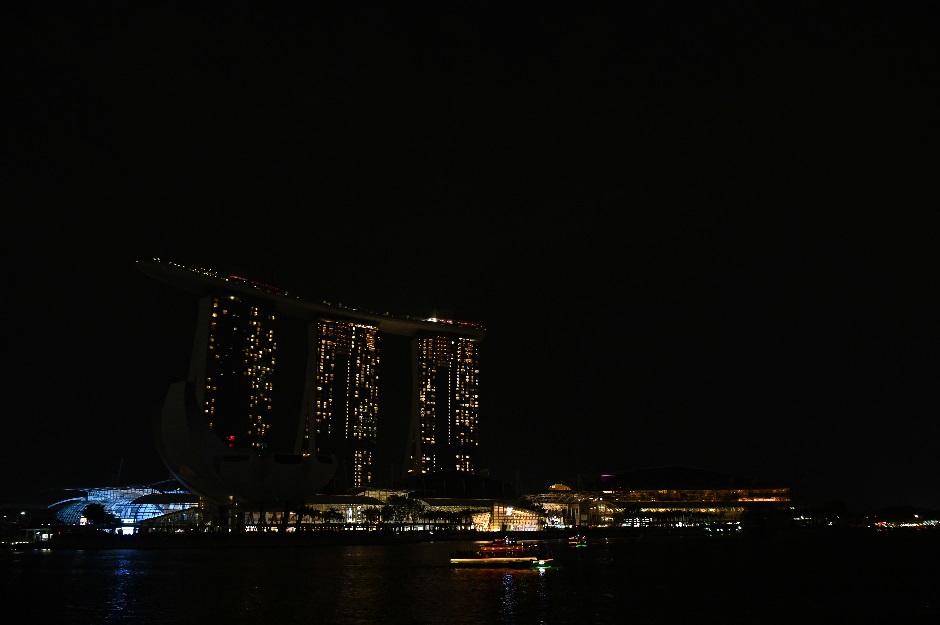 A general view of the Marina Bay Sands hotel and resort are seen with the lights turned off during the Earth Hour environmental campaign in Singapore on March 30, 2019. PHOTO: AFP