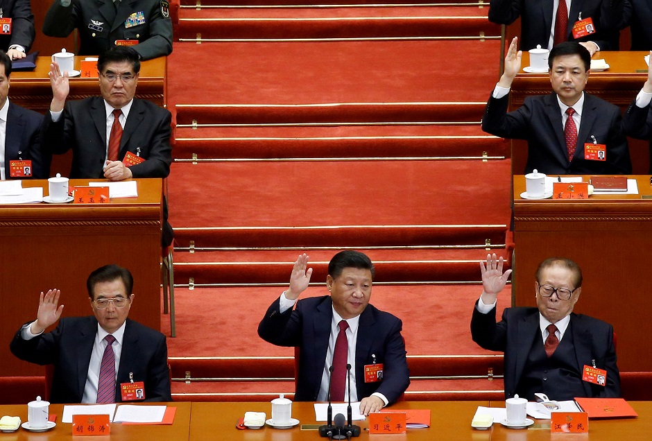 Xi Jinping has abandoned the cautious approach of his predecessors. Here he is seen flanked by former presidents Hu Jintao (left) and Jiang Zemin (right) at the 19th Communist Party Congress in Beijing in October 2017. PHOTO: REUTERS