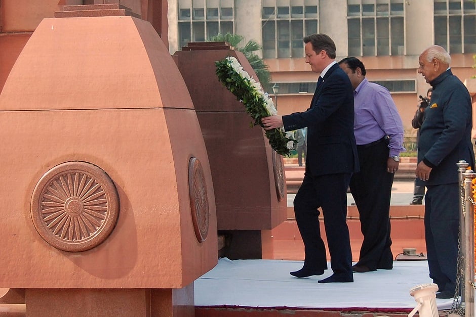 In this file photo taken on February 20, 2013 British Prime Minister David Cameron lays a wreath in tribute to the Jallianwala Bagh martyrs at the Jallian wala Bagh memorial in Amritsar. PHOTO: AFP