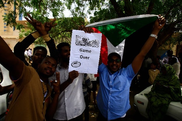 Sudanese demonstrators gather in a street in central Khartoum. PHOTO: AFP