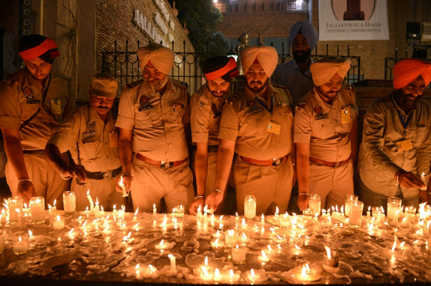 The chief minister of Punjab state said thousands attended a candlelight march Friday in memory of the victims. PHOTO: AFP