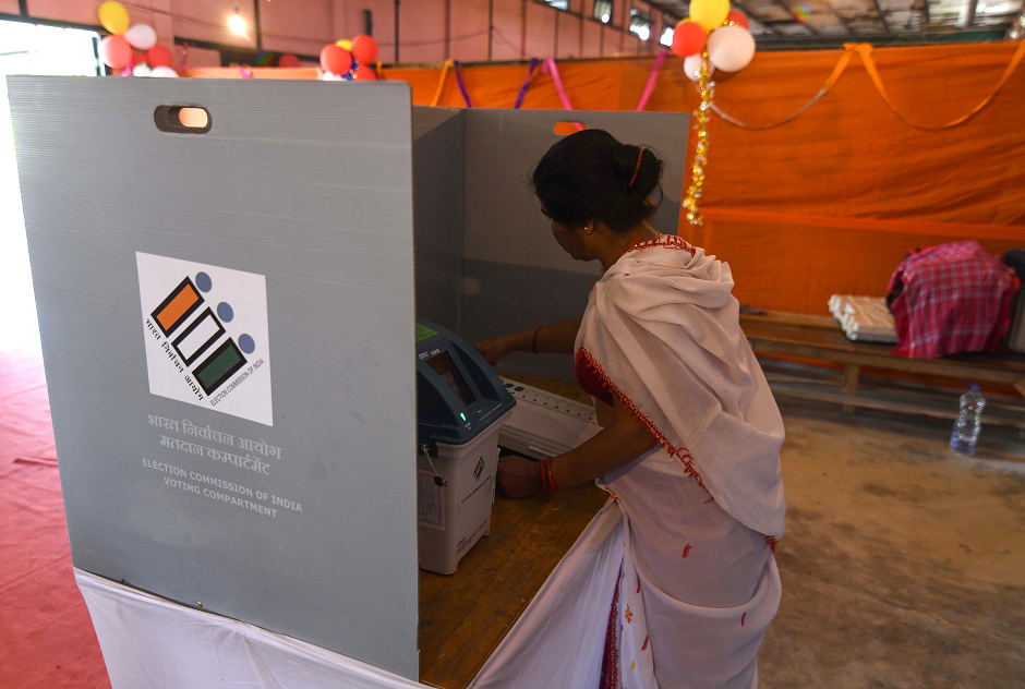 An Indian woman casts her vote at a polling station during India's general election in Samuguri, some 155 km from Guwahati, the capital city of India s northeastern state of Assam, on April 11, 2019. PHOTO: AFP