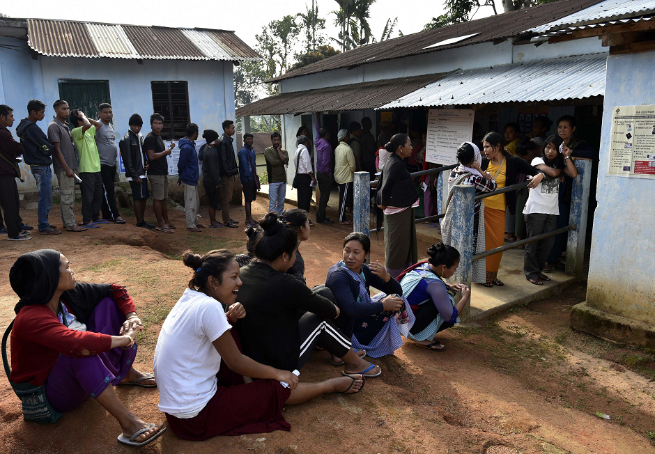 Indian voters stand in a queue to caste their vote at a polling station during India's general electionin in Borgang village, in the northeastern Indian state of Meghalaya, India April 11, 2019. PHOTO: AFP