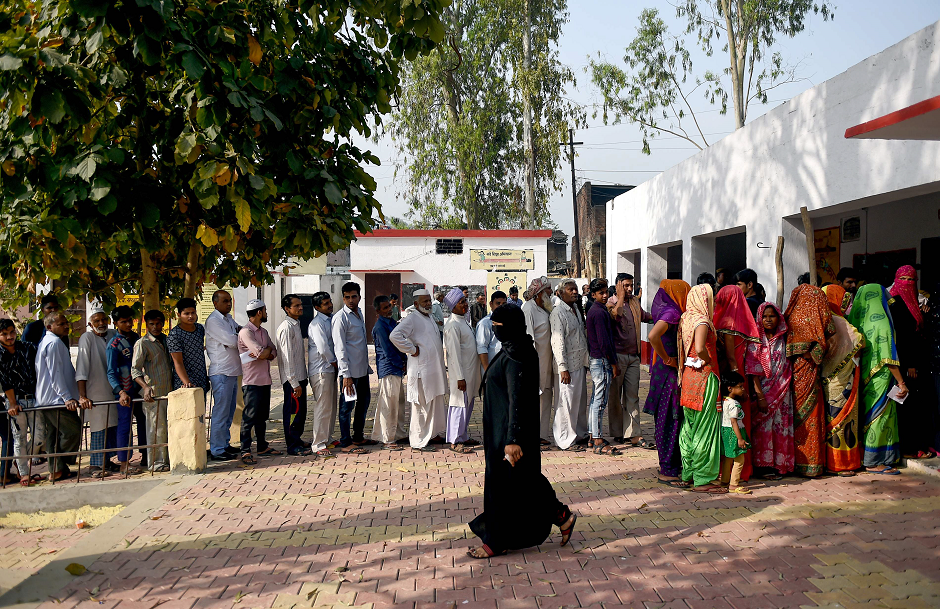 Indian voters stand in a queue to cast their vote at a polling station during India's general election in in Kawaal village near Muzaffarrnagar in the northern Indian state of Uttar Pradesh on April 11, 2019. PHOTO: AFP