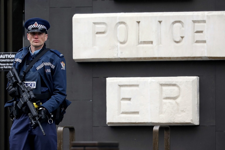 Policeman stands outside Christchurch mosque. Picture courtesy AFP