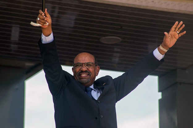 Sudan's President Omar al-Bashir gestures during a peace ceremony at John Garang Mausoleum in Juba, South Sudan. PHOTO: AFP