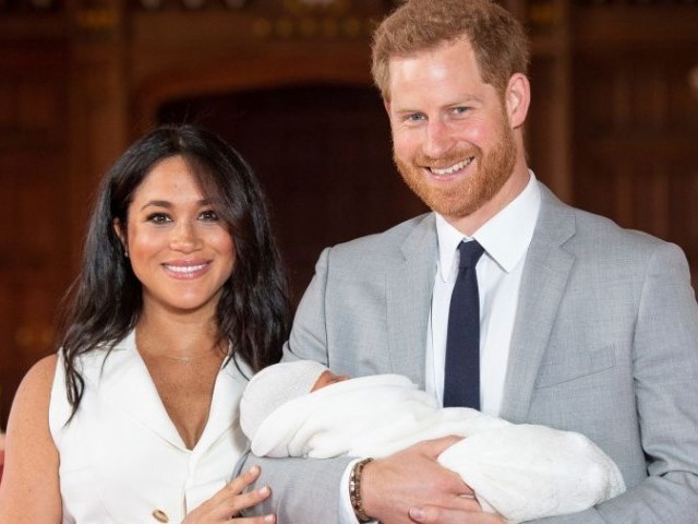 Britain's Prince Harry and Meghan, Duchess of Sussex are seen with their baby son, who was born on Monday morning, during a photocall in St George's Hall at Windsor Castle, in Berkshire, Britain May 8, 2019. PHOTO: REUTERS