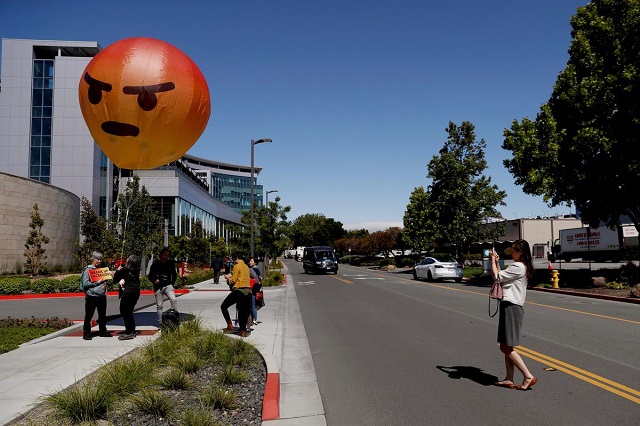 inflatable angry emoji looms over facebook annual meeting as users vent frustrations