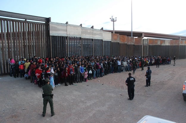 this image released by us border and custom protection on their flickr account on may 30 2019 shows a group of migrants apprehended after crossing the border from mexico on may 29 2019 photo us customs and border protection afp