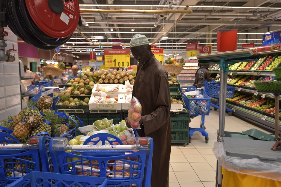 3.A man shops at the Carrefour supermarket in Abidjan on May 4, 2019 on the eve of the start of the Ramadan, the Muslim holy month of fasting. PHOTO: AFP