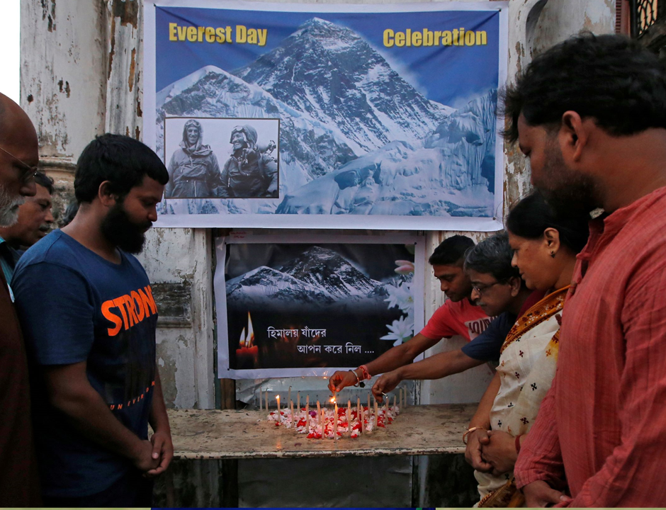 People light candles during a prayer service for those who died on Mount Everest during expeditions as they celebrate Everest Day in Kolkata, India, May 29, 2019. REUTERS