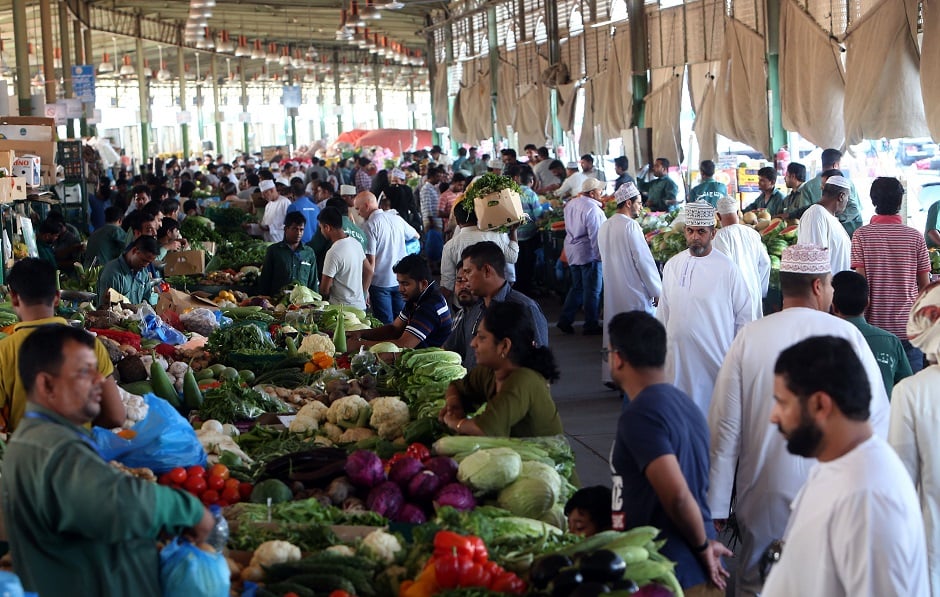 6.Omanis buy fresh food products at the Mawaleh market in the capital Muscat ahead of the Muslim fasting month of Ramadan. PHOTO: AFP