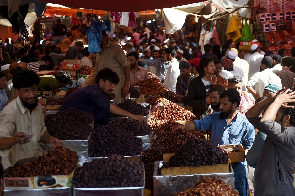 Muslims buy dates at a market in preparation for the Muslim fasting month of Ramadan in Karachi, Pakistan. PHOTO: AFP