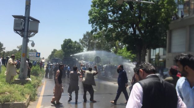 Islamabad Police uses water cannons to disperse crowd. PHOTO: EXPRESS