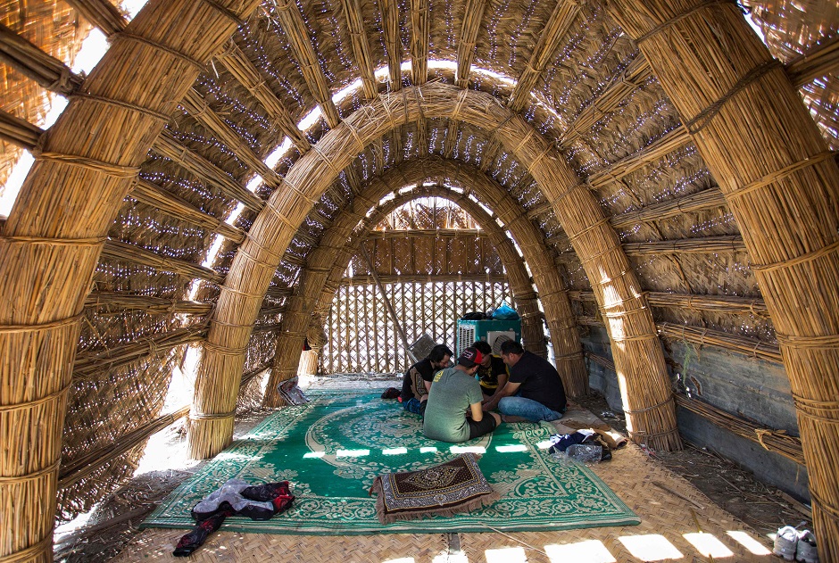 Tourists sitting inside a floating palm reed-woven house in the marshes of the southern Iraqi district of Chibayish in Dhi Qar province, about 120 kilometres northwest of the southern city of Basra. PHOTO: AFP