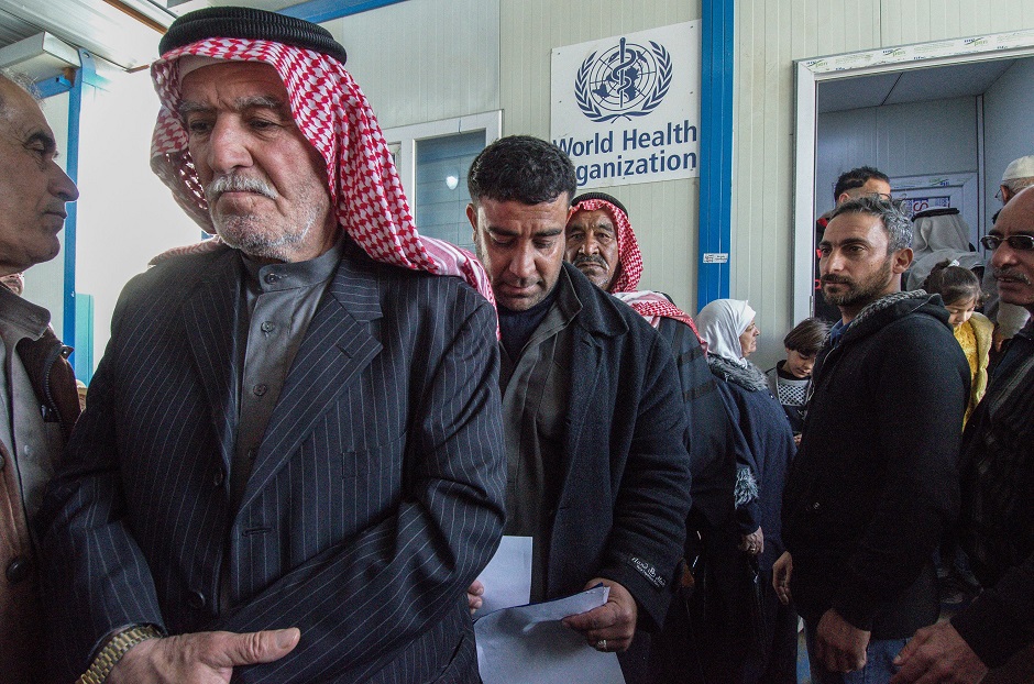 Iraqi patients queue to get hearing consultation at Jumhuri hospital, a specialised hearing impairment centre, in west Iraq's city Mosul. PHOTO: AFP