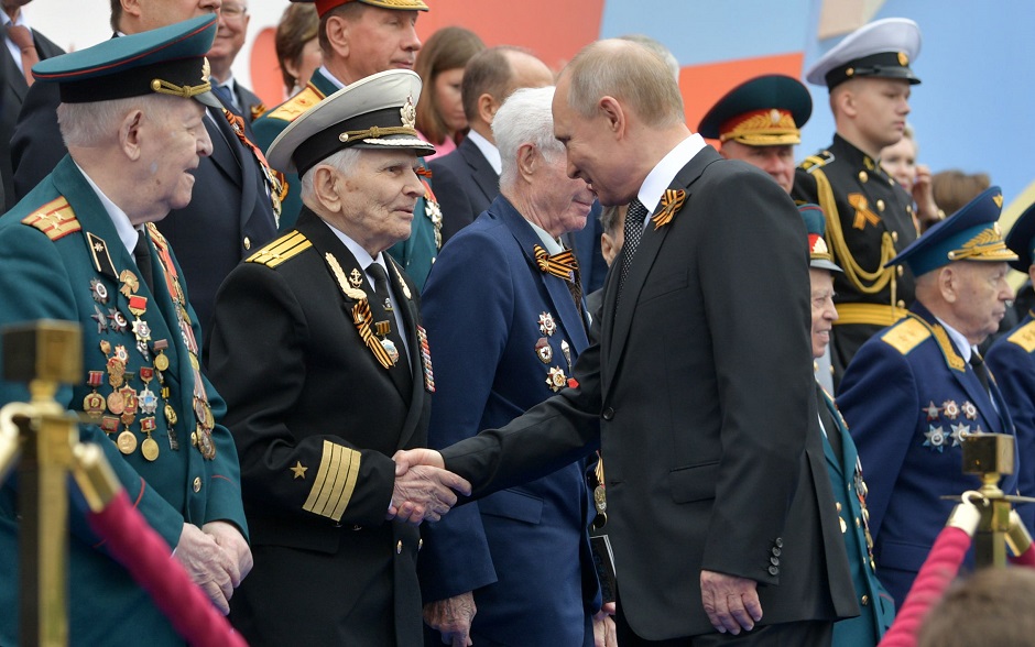 Russian President Vladimir Putin greets veterans prior to the Victory Day military parade at Red Square in downtown Moscow on May 9, 2019. - Russia celebrates the 74th anniversary of the victory over Nazi Germany. PHOTO: AFP