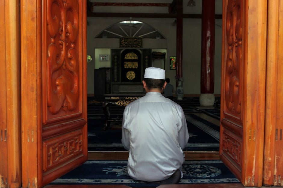 A muslim man prays during a noon prayer before the holy fasting month of Ramadan, at a mosque in Kunming, Yunnan province, China. PHOTO: REUTERS