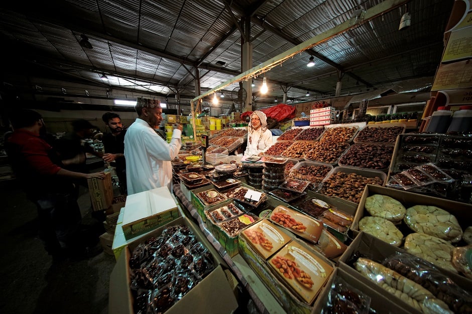 A man bargains with a dates seller at the Bahrain Central Market, ahead of the holy fasting month of Ramadan in Manama, Bahrain. PHOTO: REUTERS