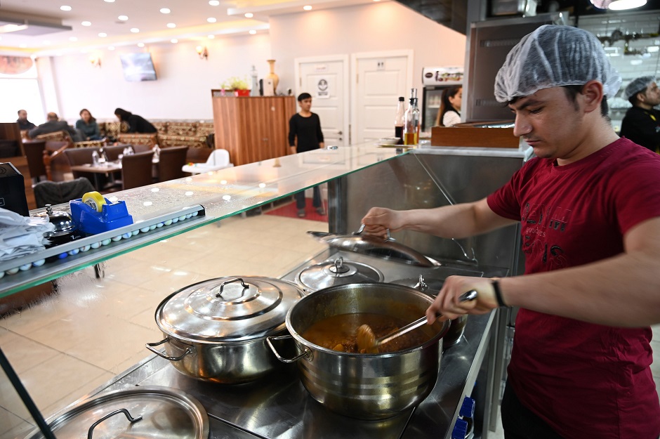 Afghan employees of an Afghan Kebab restaurant are at work at Esenyurt district in Istanbul. PHOTO: AFP