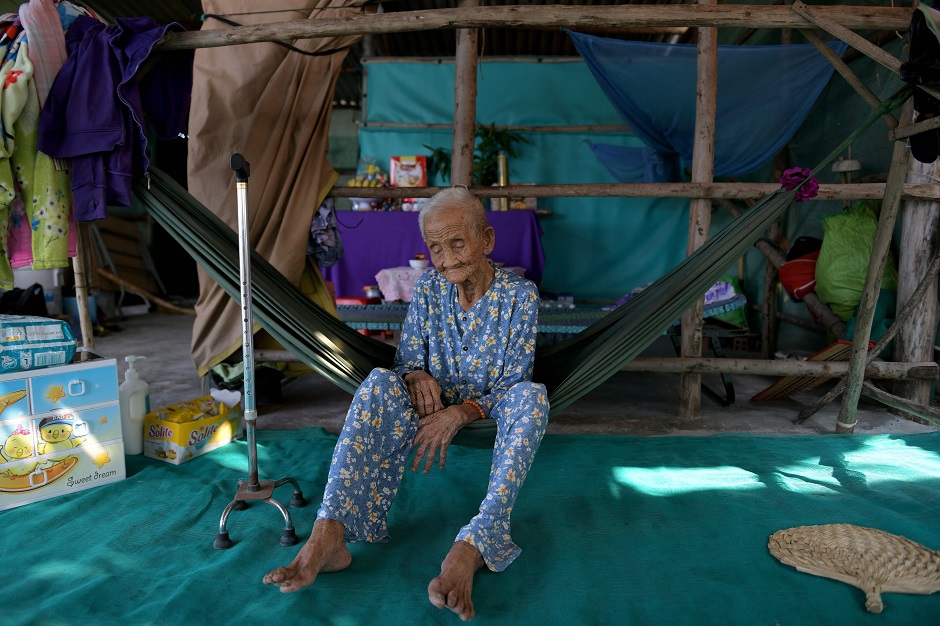 99-year-old Pham Thi Ca resting in a hammock in her makeshift shelter in Van Phong Bay. PHOTO: AFP