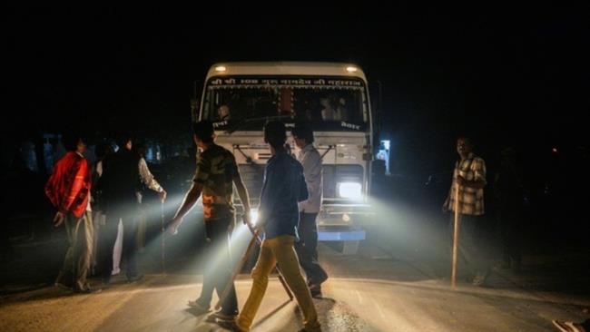 The file photo shows members of the vigilante group Gau Raksha Dal (Cow Protection Squad) inspect a truck on a highway in Taranagar in the desert state of Rajasthan, India. PHOTO: AFP 