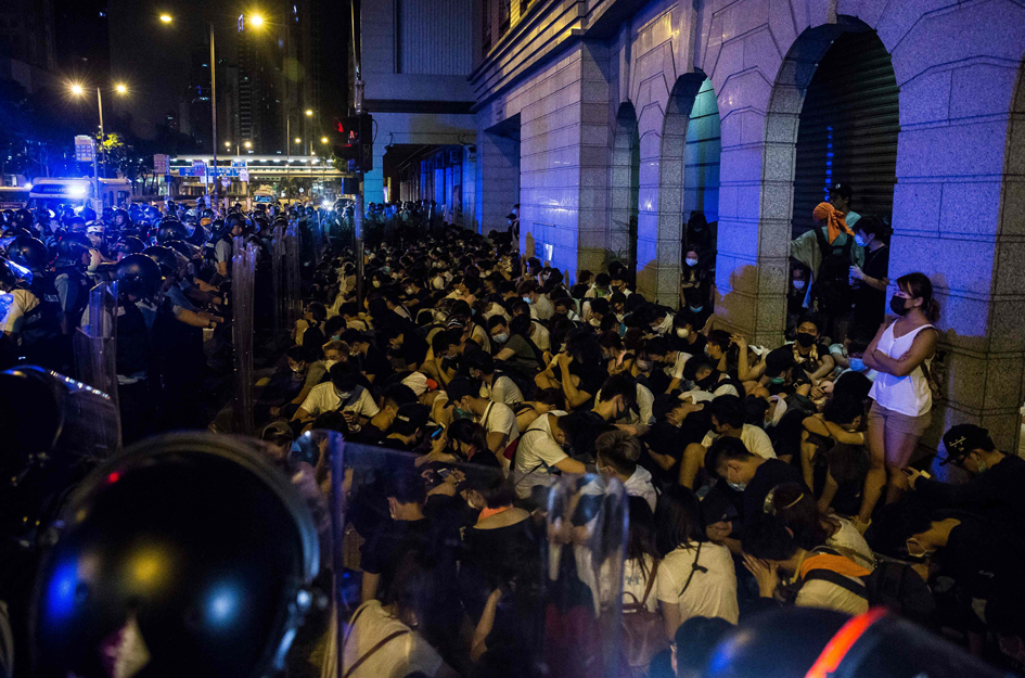 Protesters are detained by police after a rally against a controversial extradition law proposal in Hong Kong on June 10, 2019. - Hong Kong witnessed its largest street protest in at least 15 years on June 9 as crowds massed against plans to allow extraditions to China, a proposal that has sparked a major backlash against the city's pro-Beijing leadership. Photo: AFP