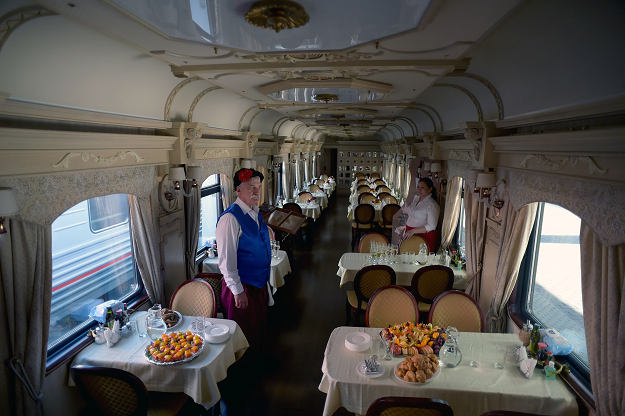 Gertruda Cless poses at a sleeping car of the first tourist train passing through Russia's Arctic regions to Norway as it prepares to leave Saint Petersburg for a 11-day trip with 91 passengers on board, June 5, 2019. PHOTO: AFP