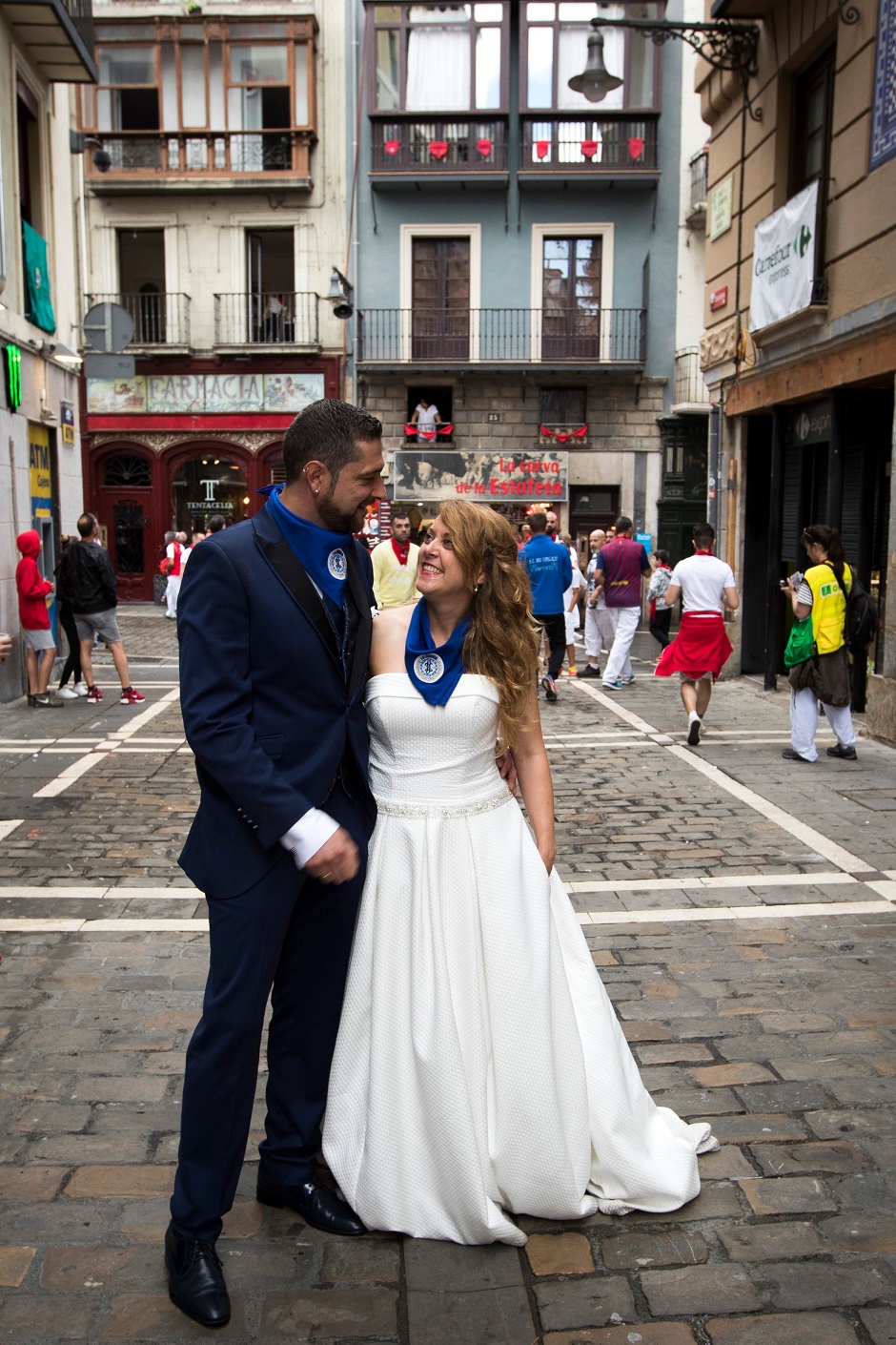 Newlyweds pose at the end of the third bullrun. PHOTO: AFP.