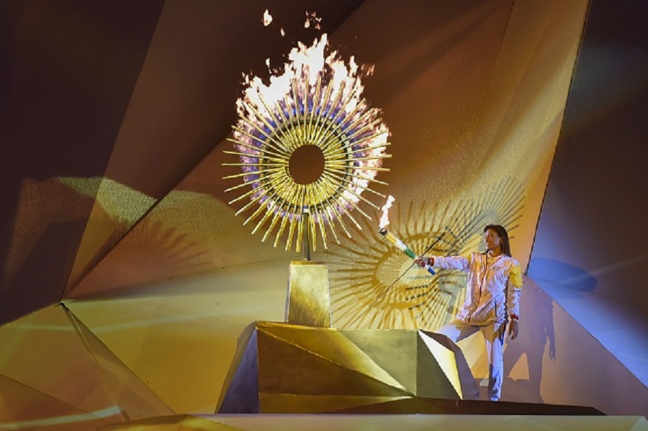 Peruvian ex-volleyball player Cecilia Tait lights the flame during the opening ceremony of the Lima 2019 Pan-American Games at the National Stadium in Lima. PHOTO: AFP