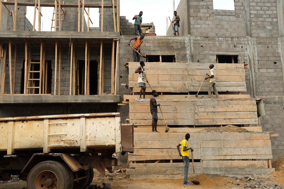 Labourers work on a building construction site, in Bangui. PHOTO: Reuters