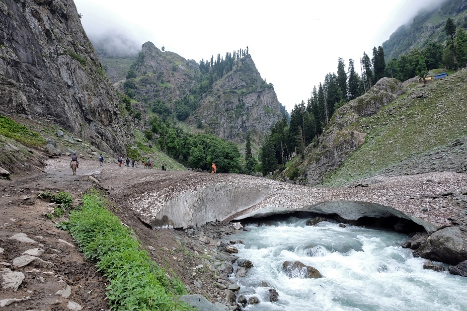 Hindu pilgrims trek through mountains to reach the holy Amarnath cave shrine, where they worship an ice stalagmite that Hindus believe to be the symbol of Lord Shiva, near Pahalgam in the Kashmir region. PHOTO: Reuters