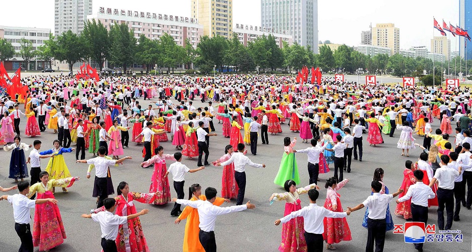 People dance as North Korea commemorates the 66th anniversary of the Korean War Armistice in Pyongyang, North Korea. PHOTO: Reuters