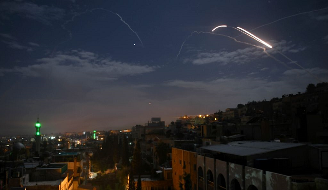 syrian air defence batteries respond to an israeli missile strike against an alleged iranian target near damascus photo afp