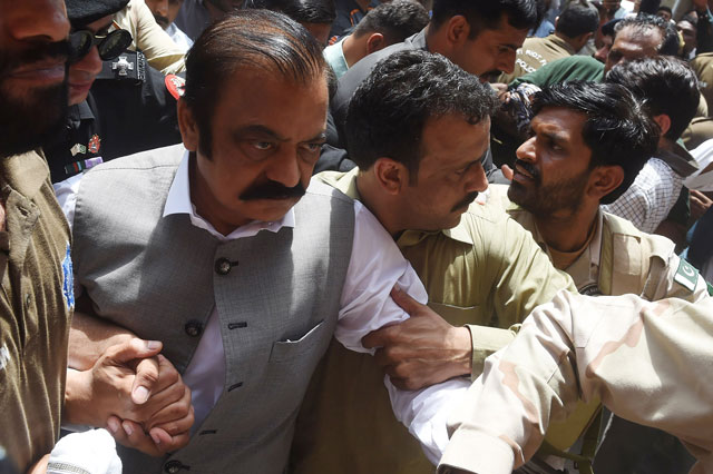 security officials of the anti narcotics force anf escort arrested senior leader of pakistan muslim league nawaz pml n rana sanaullah to court in lahore on july 2 2019 photo afp