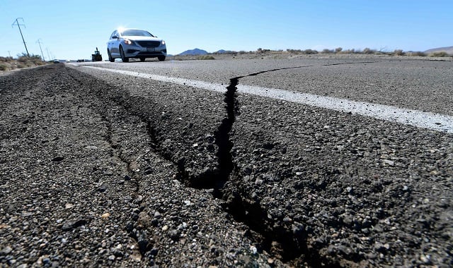 cracks are seen on the road after the earthquake photo afp