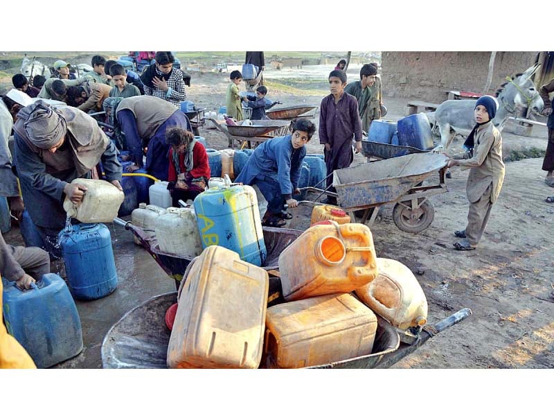 people fill cans from public taps amid water shortage in rawalpindi photo app